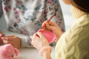 Two women knitting